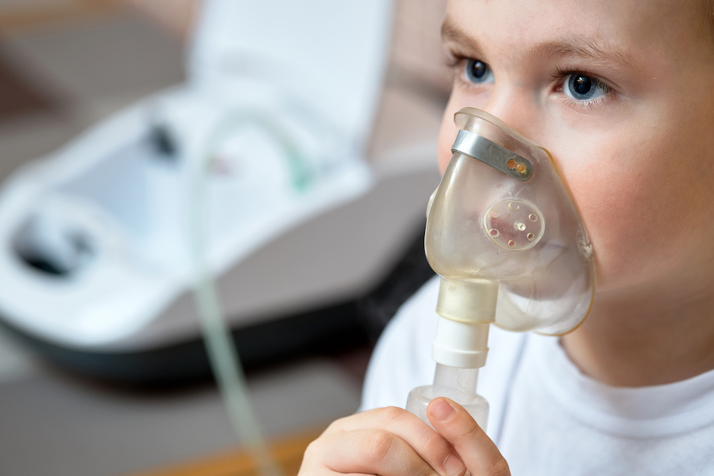 child using a nebulizer because they have obesity hypoventilation syndrome